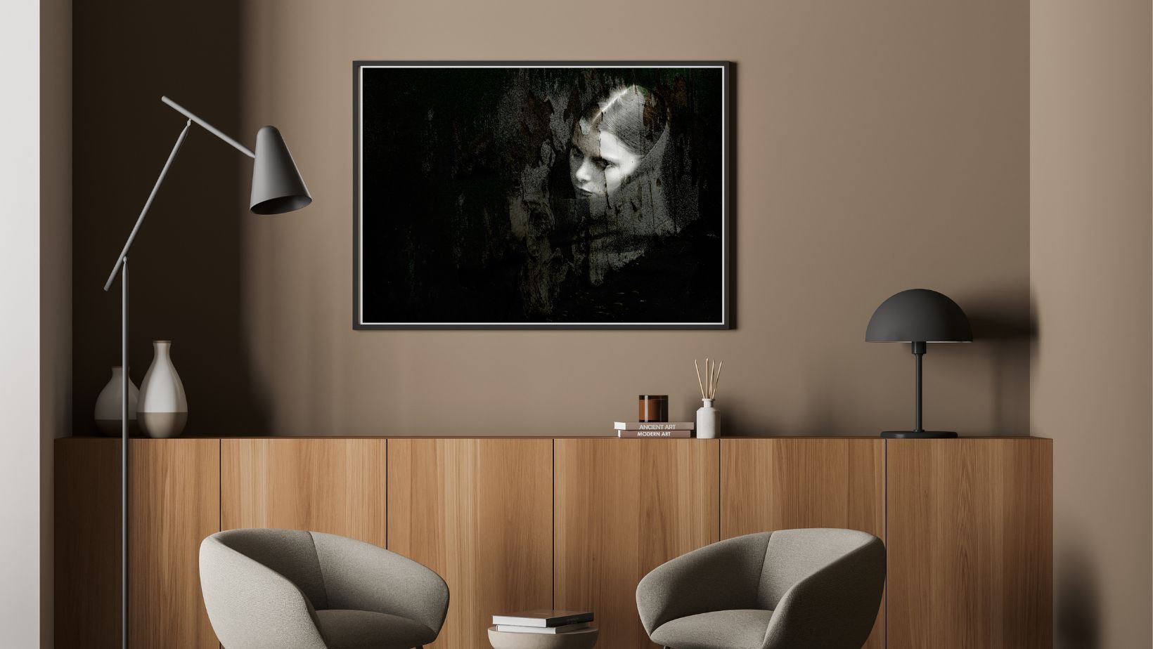 Modern interior with a framed black and white portrait above a wooden cabinet.