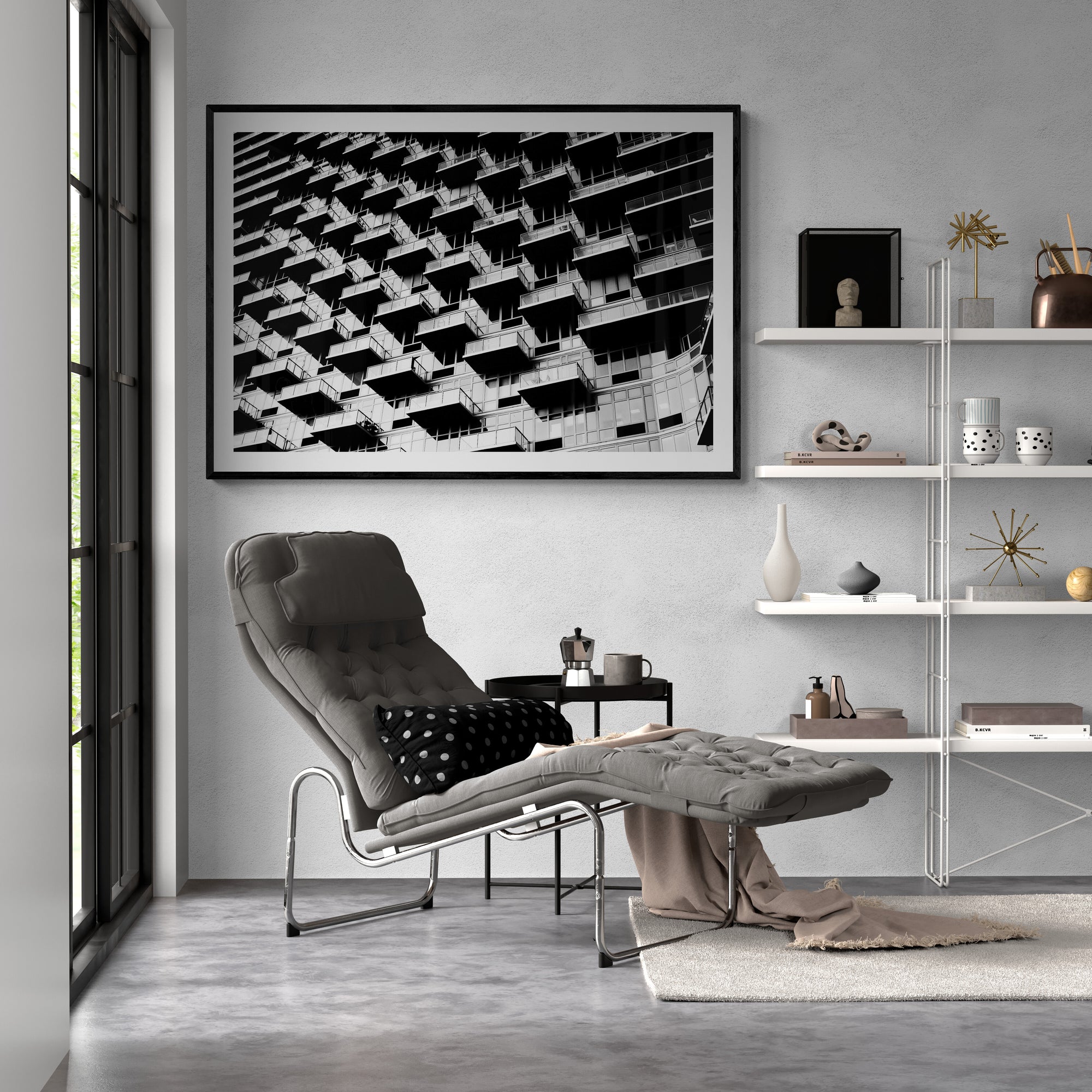 Modern living room with a gray armchair, coffee table, and wall art.