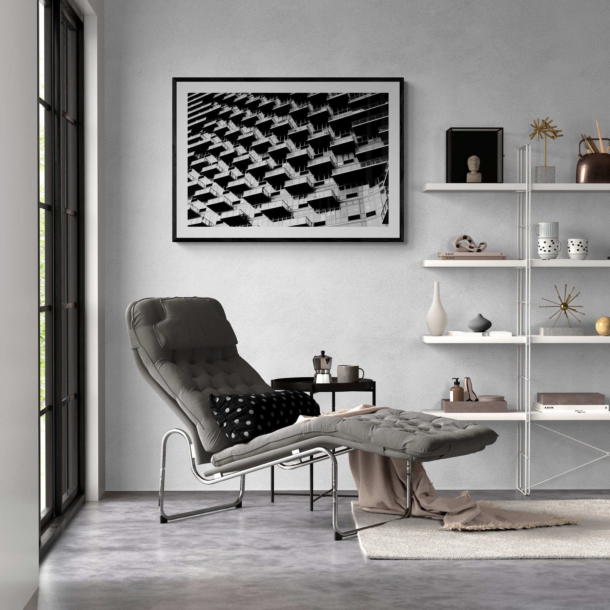 Modern living room with a gray armchair, coffee table, and shelves with decorative items.