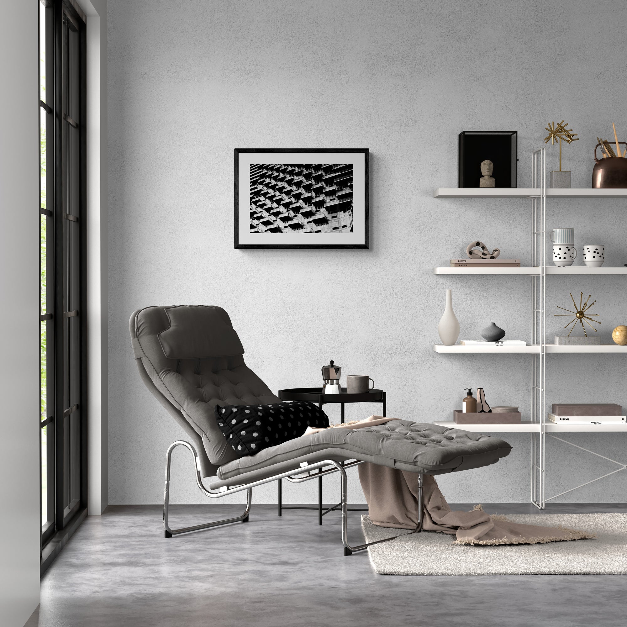 Modern living room with a gray lounge chair, shelves, and wall art.