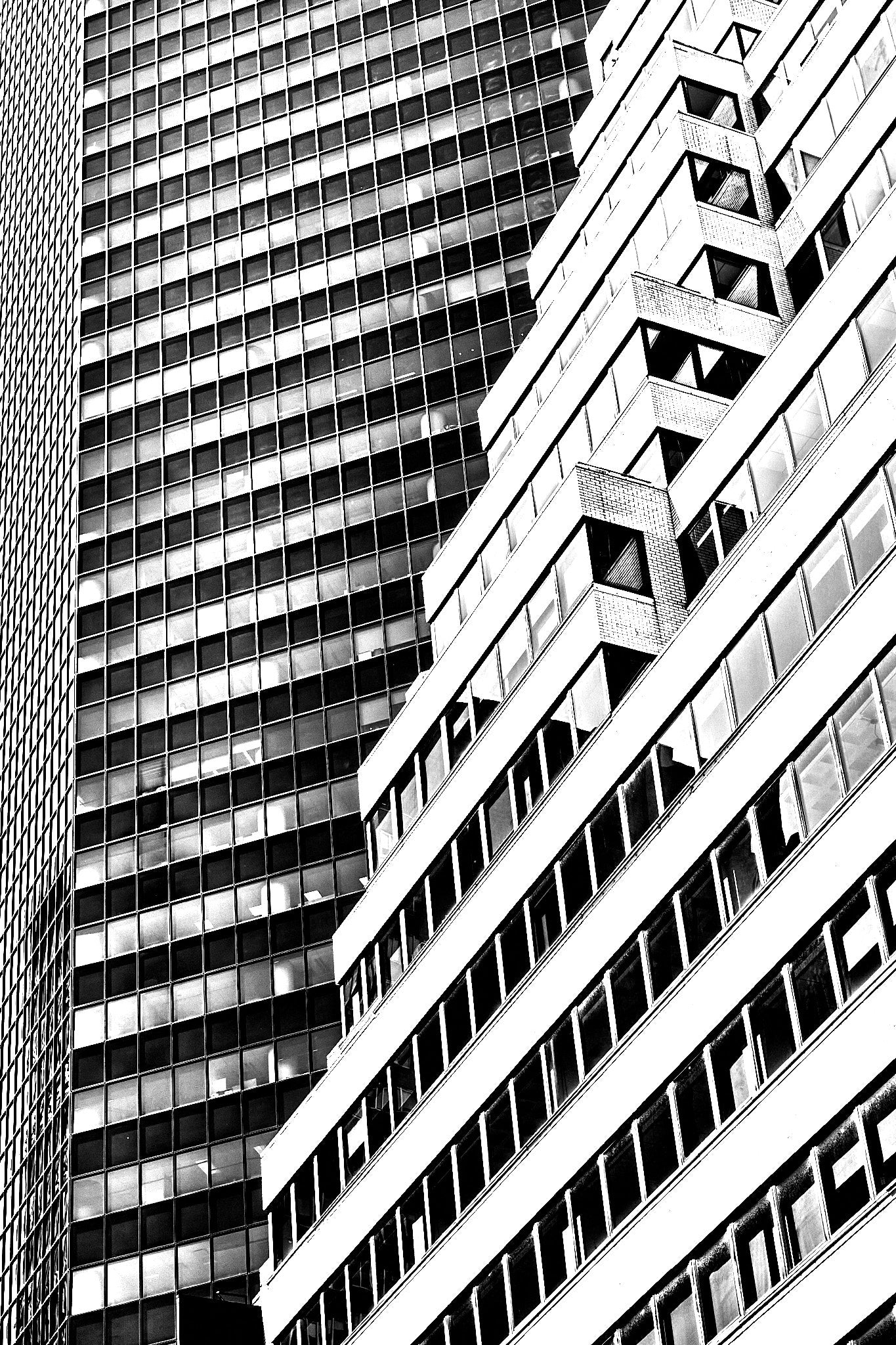 Black and white architectural photograph of a cityscape with tall buildings.