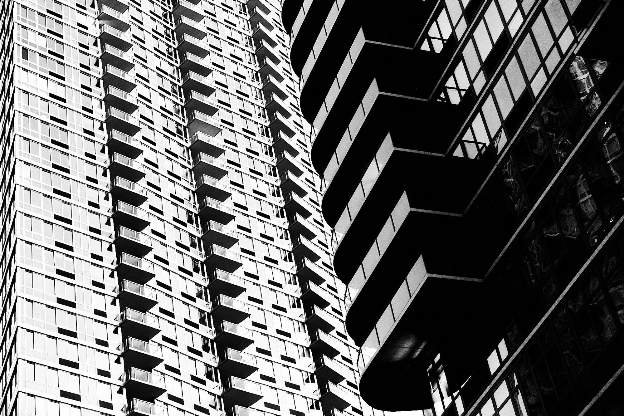 Black and white architectural photograph of a modern building facade