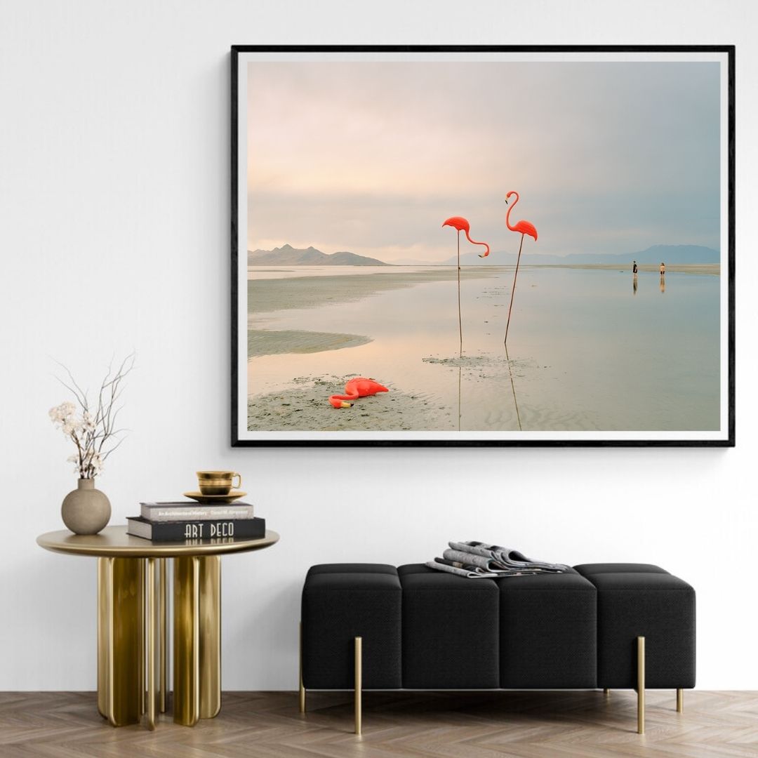 Framed artwork of flamingos on a beach in a modern living room.