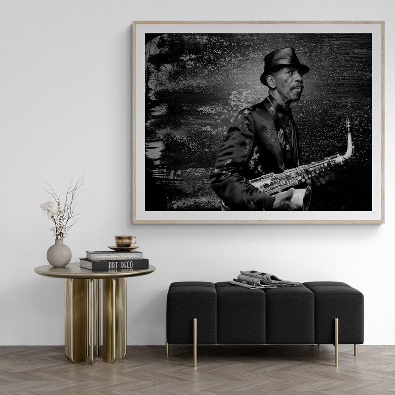 Framed black and white artwork of a musician playing saxophone in a modern living room.