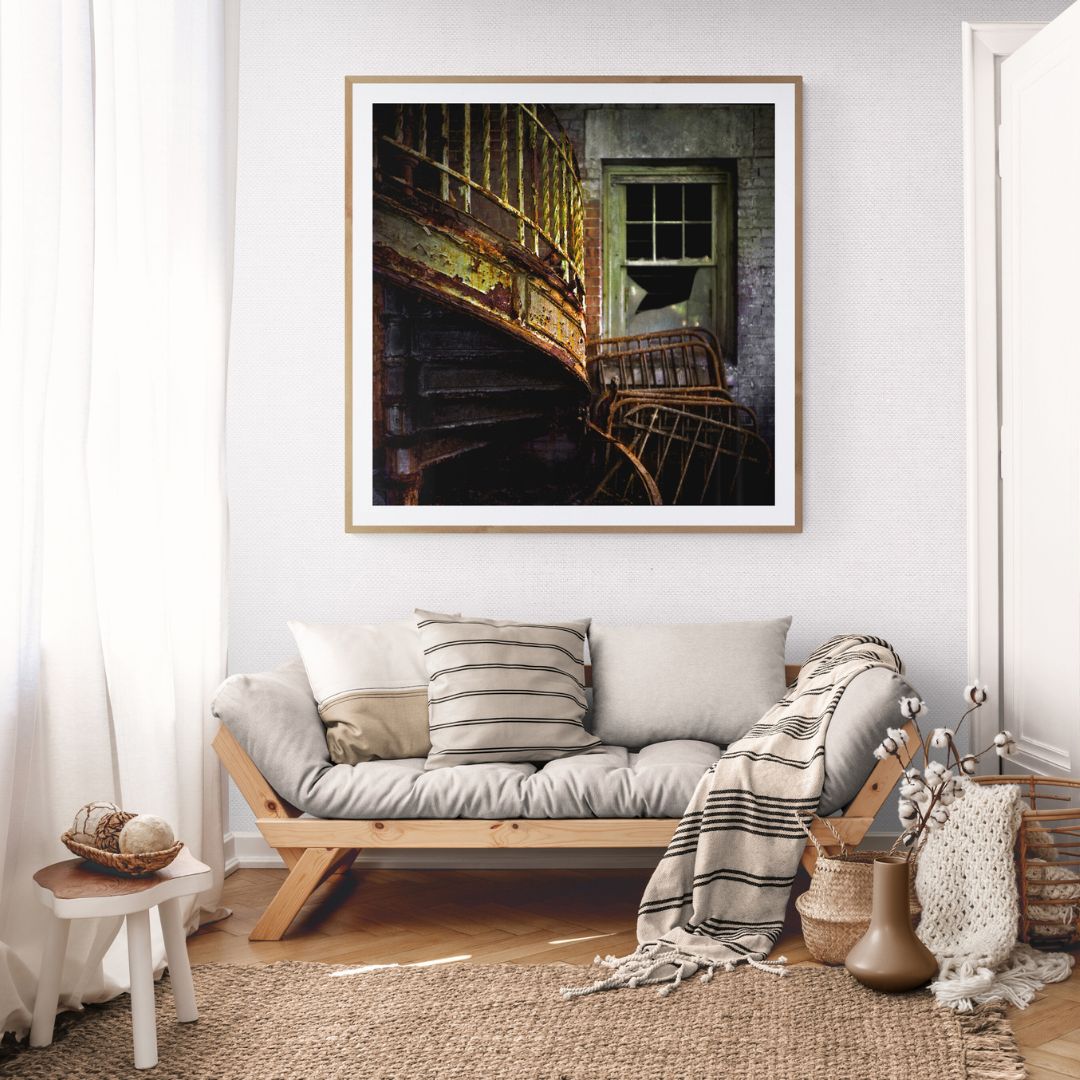 Living room with a couch, decorative pillows, and a framed picture on the wall.