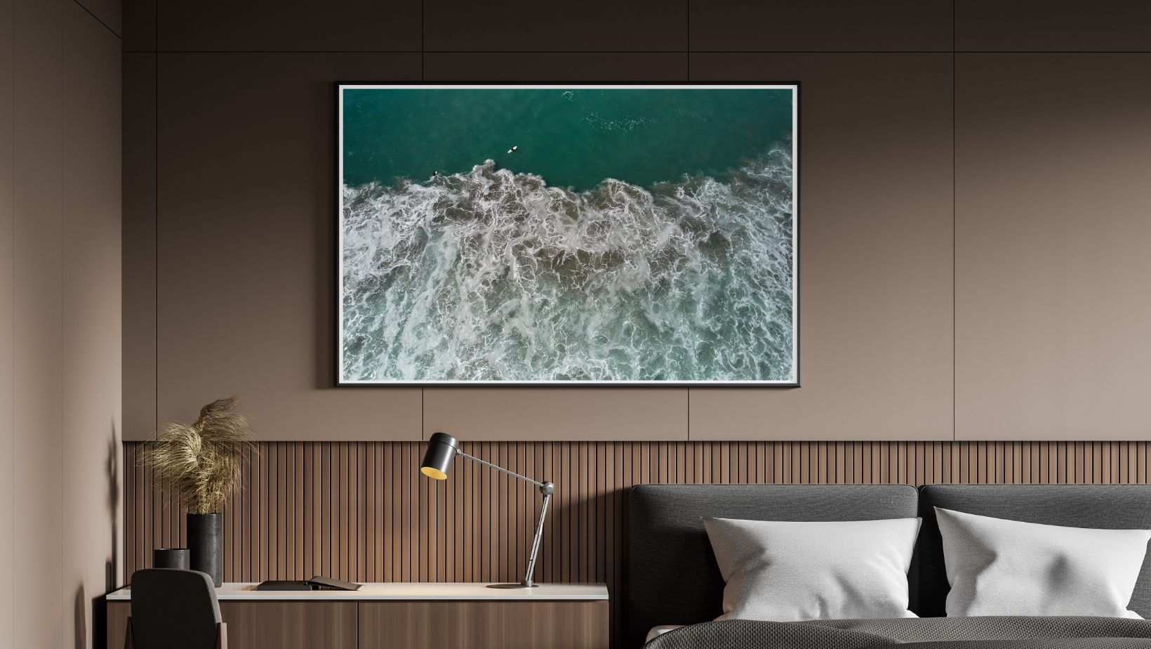 Large photographic artwork displaying an ocean scene in a modern bedroom.