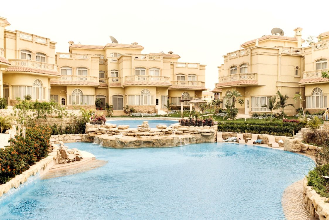 Limited Edition Print of a new building set around a large pool.