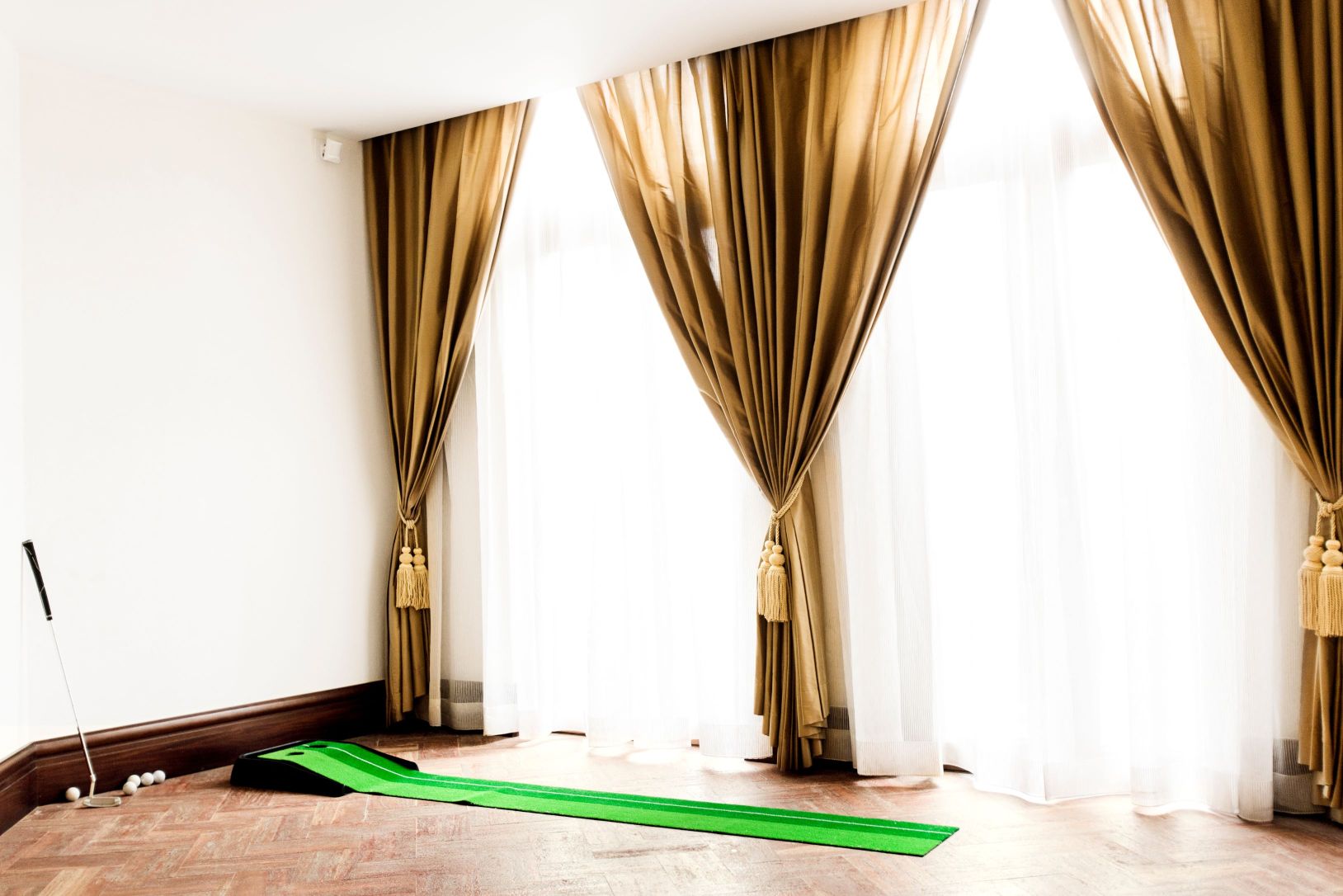 Limited Edition Print of a miniature golf set up in a grand living room.