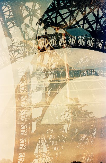 Double exposure of the Eiffel Tower and a sunset with abstract colors