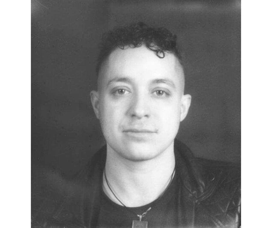 Black and white portrait of a person wearing a leather jacket.