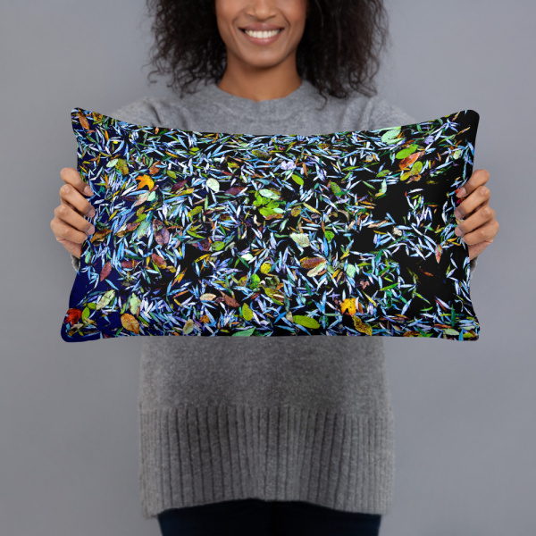 Woman holding a Rectangular pillow with a photograph of a pond covered with flower petals