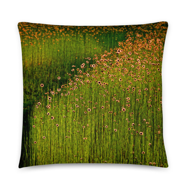 Square pillow with a photograph of a field of orange flowers