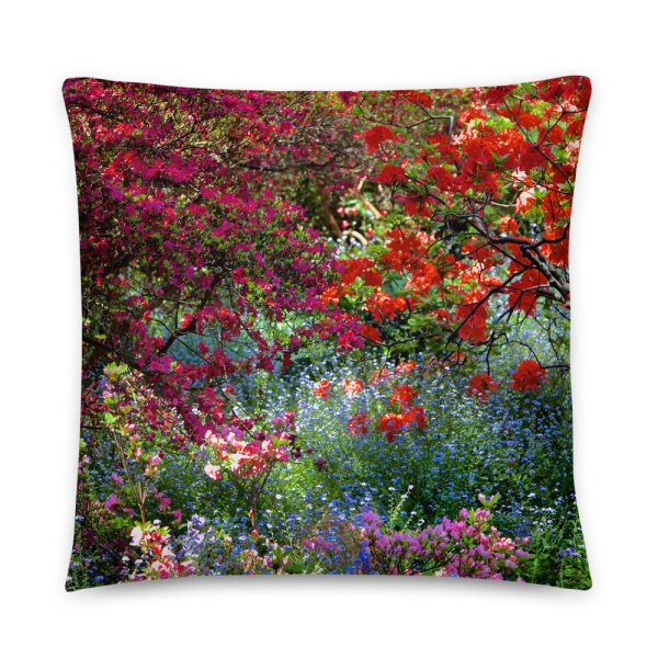 Square pillow with the photograph of a shaded and flowery spot in a park
