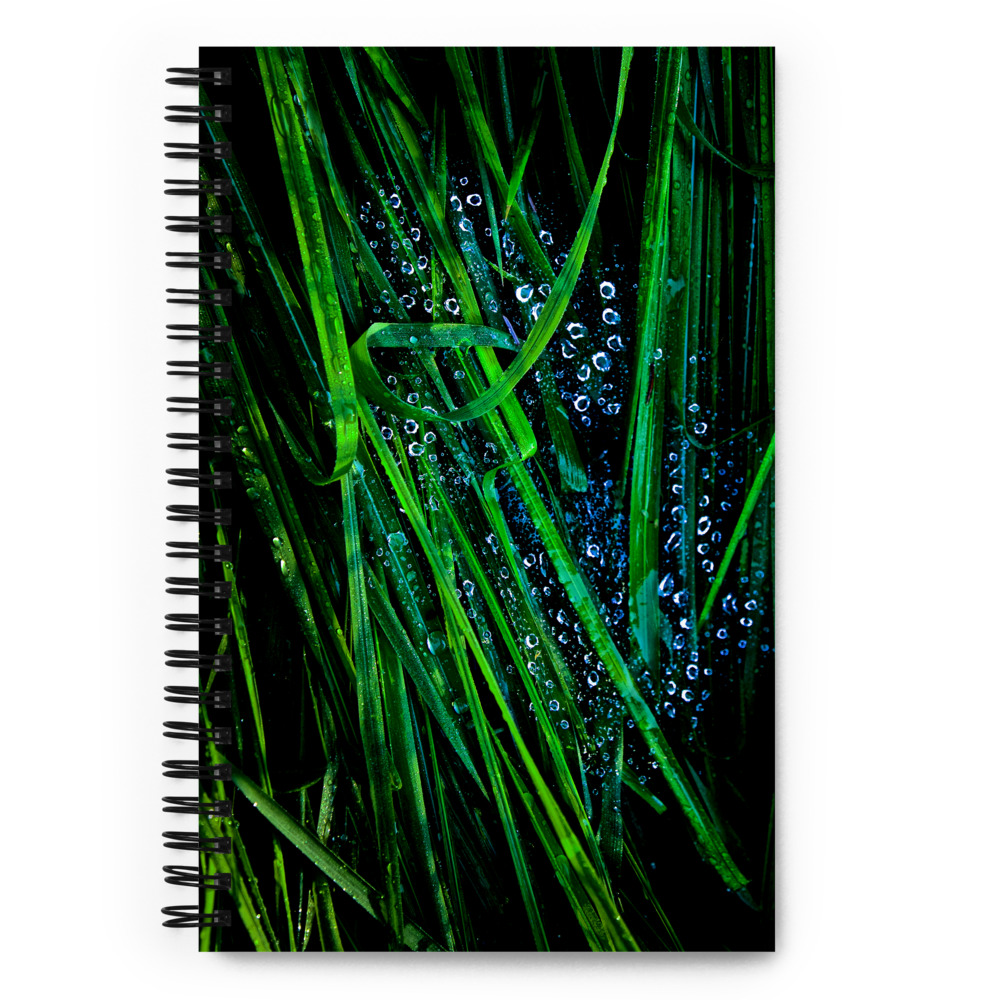 Spiral notebook with a photo of blades of grass covered with water droplets