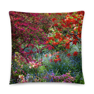 Square throw pillow with a colorful photo of a shaded and flowery spot in a park
