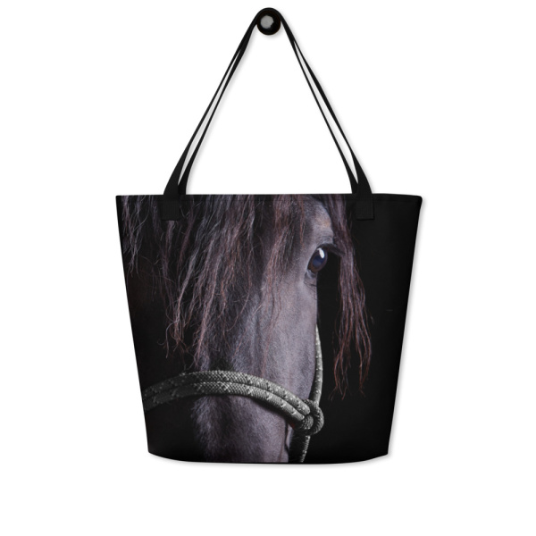 Large tote bag with a close face of a black horse against a black background