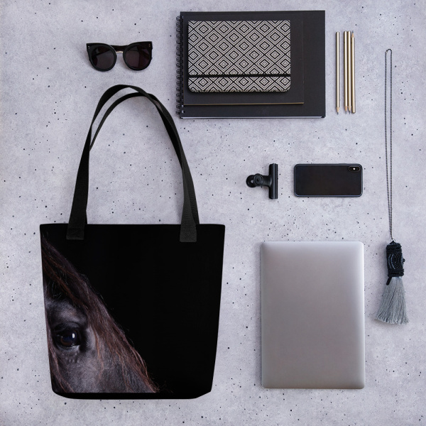 Medium tote next to a tablet, sunglasses and other accessories