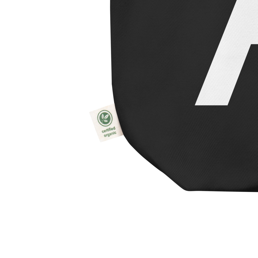 Close up of a medium size black tote bag with the initials AG written in the front