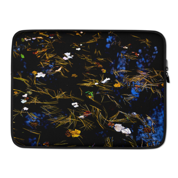 Laptop case with the photograph of a pond covered in flower petals (black tones)