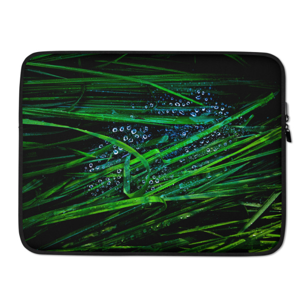 Laptop case with the photograph of blades of grass with droplets on them