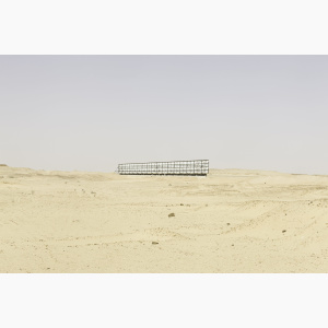 Lone billboard in the middle of a desert landscape