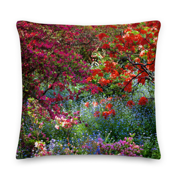 Square throw pillow with a picture of a shaded and flowery spot in a park