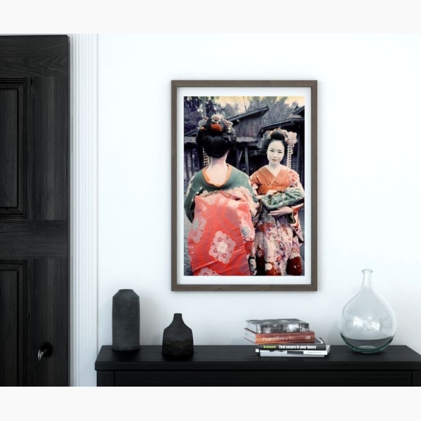 Print of Japanese geishas hanging in an entryway
