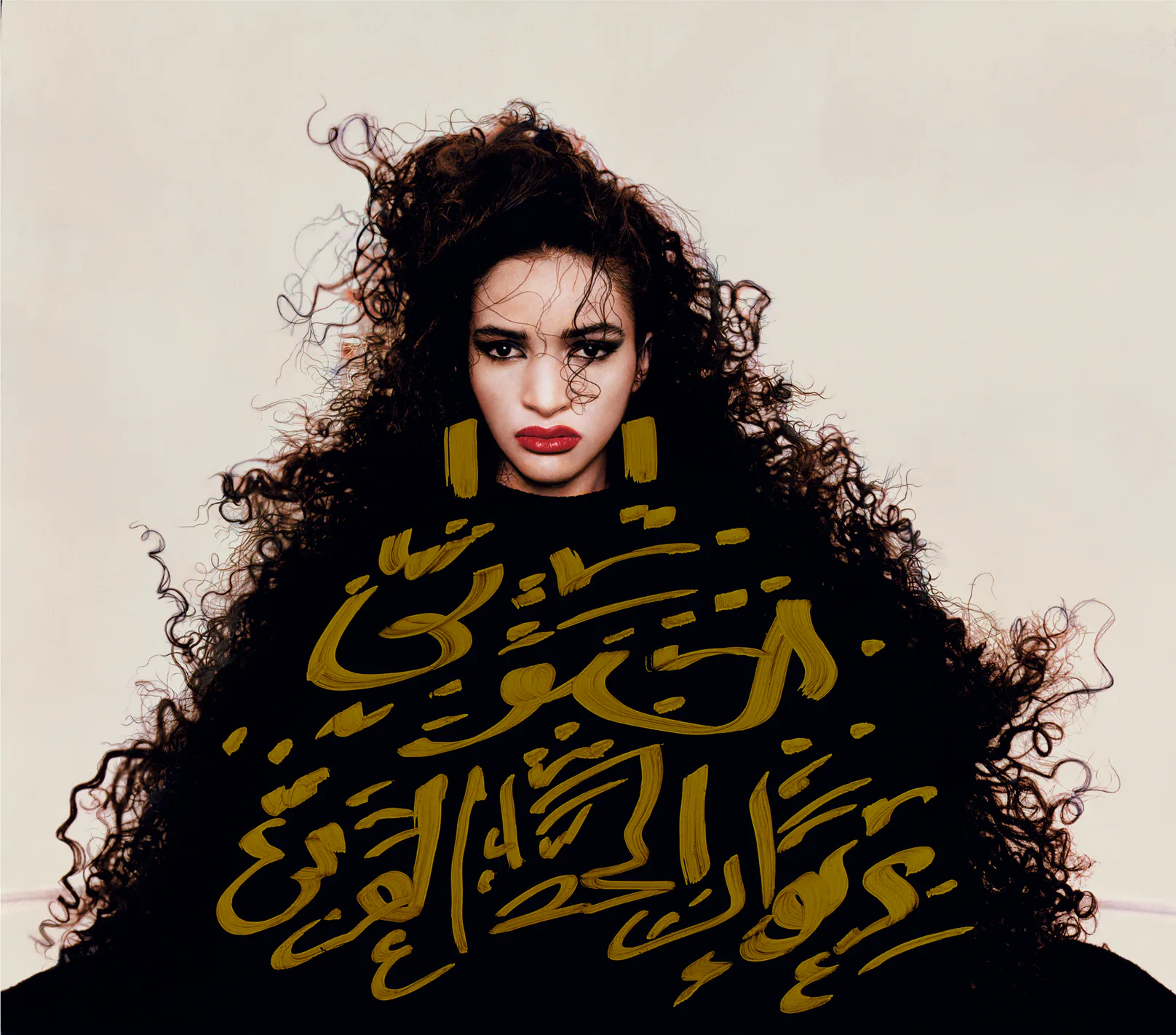 Portrait of model Farida, with handwritten Arabic calligraphy written on top of the image