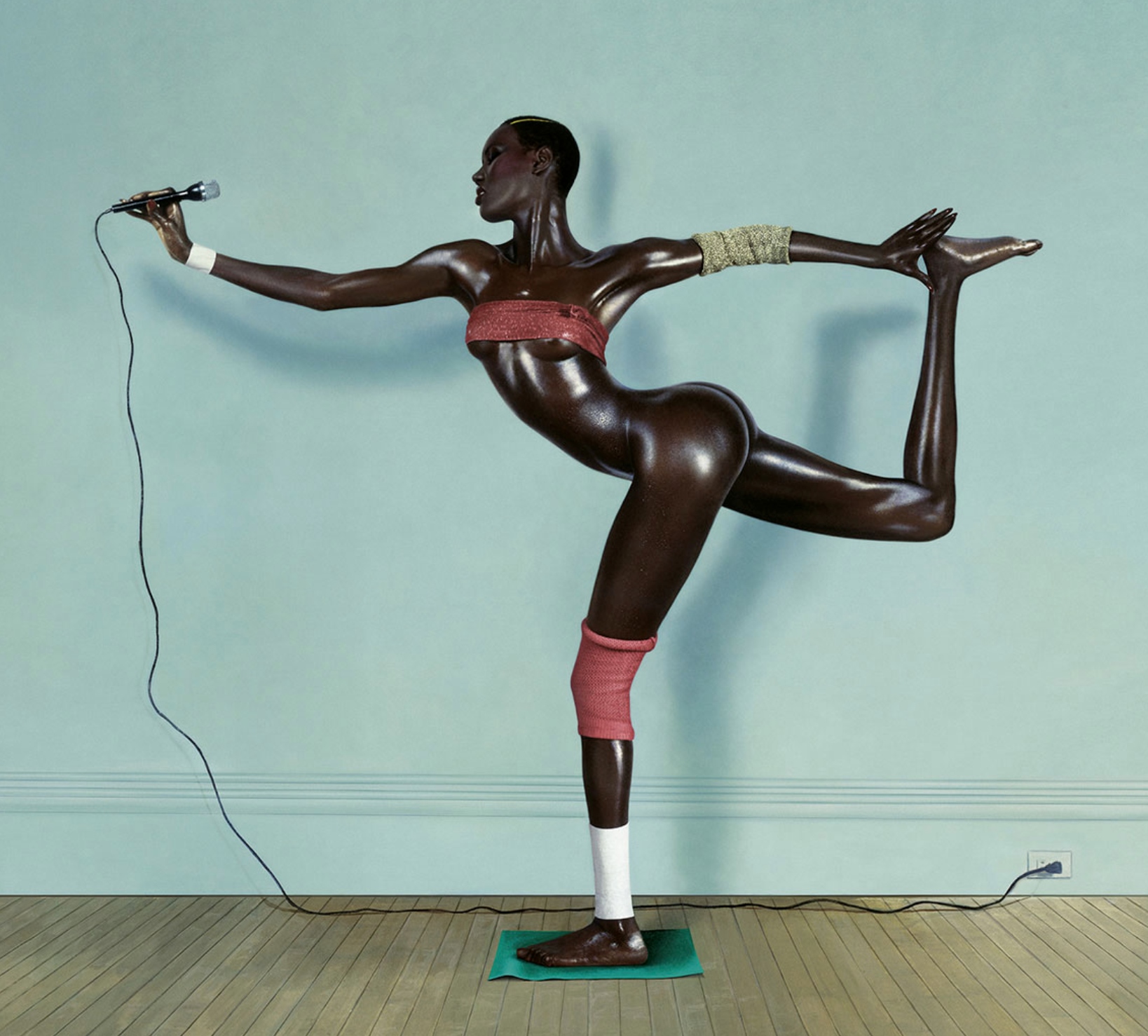 Grace Jones posing as a statue