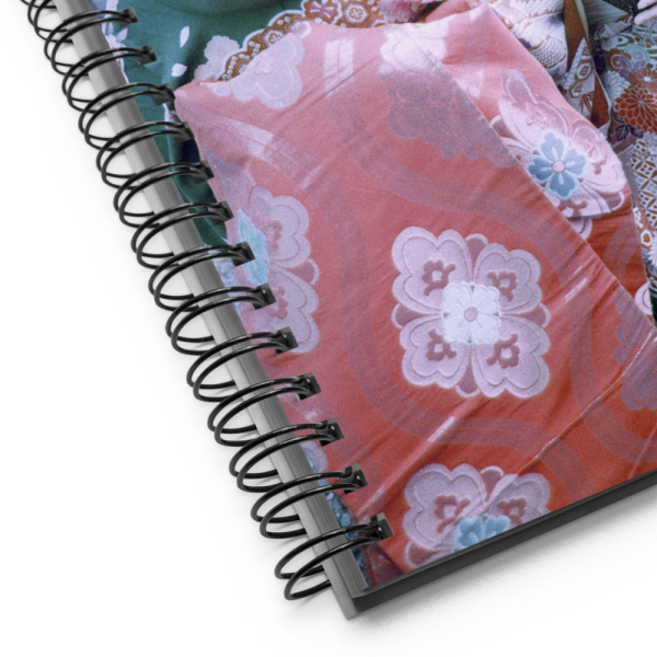 Close-up of a Notebook with the photo of Two Japanese Geishas in traditional kimonos
