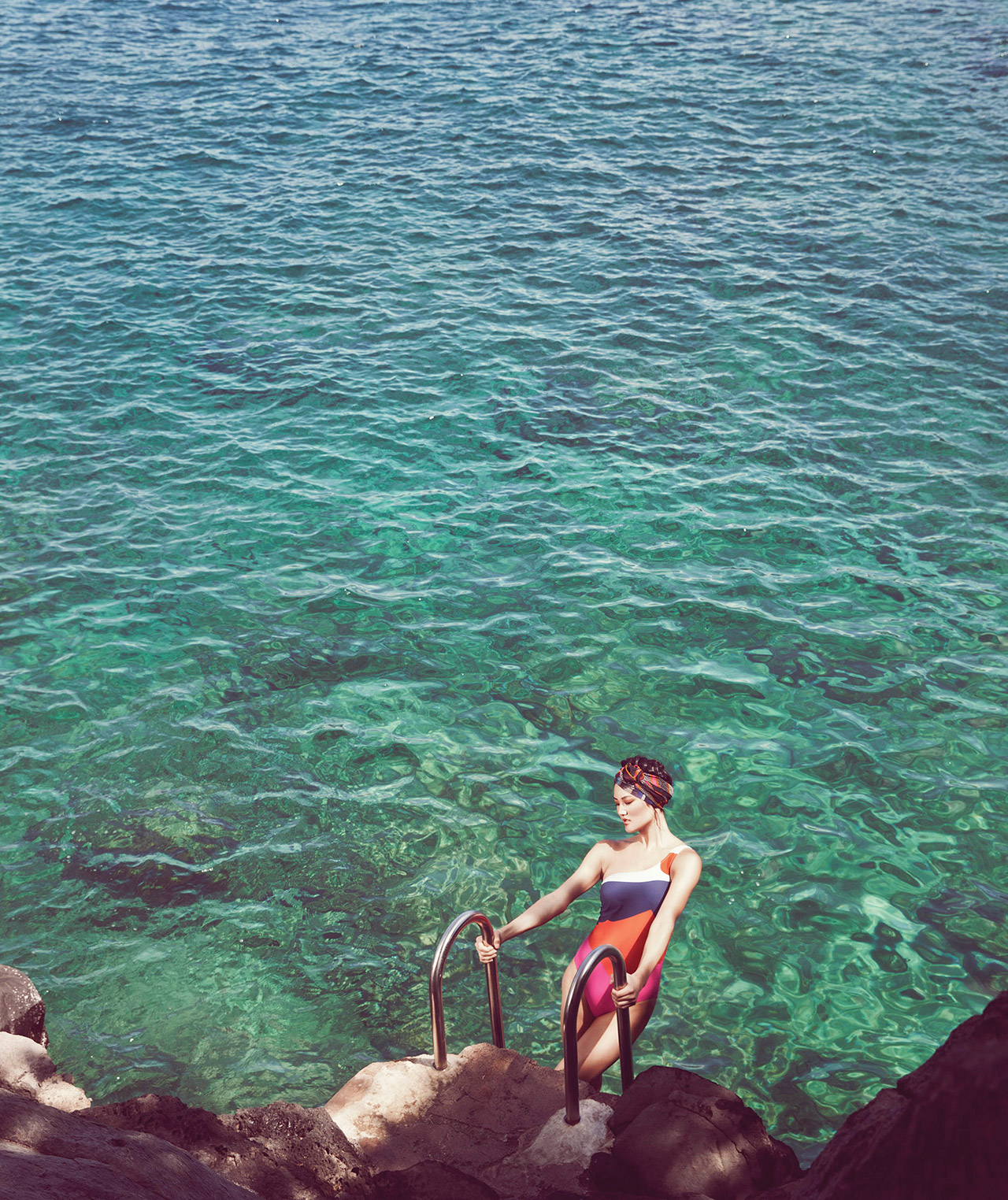 A woman getting out of the sea