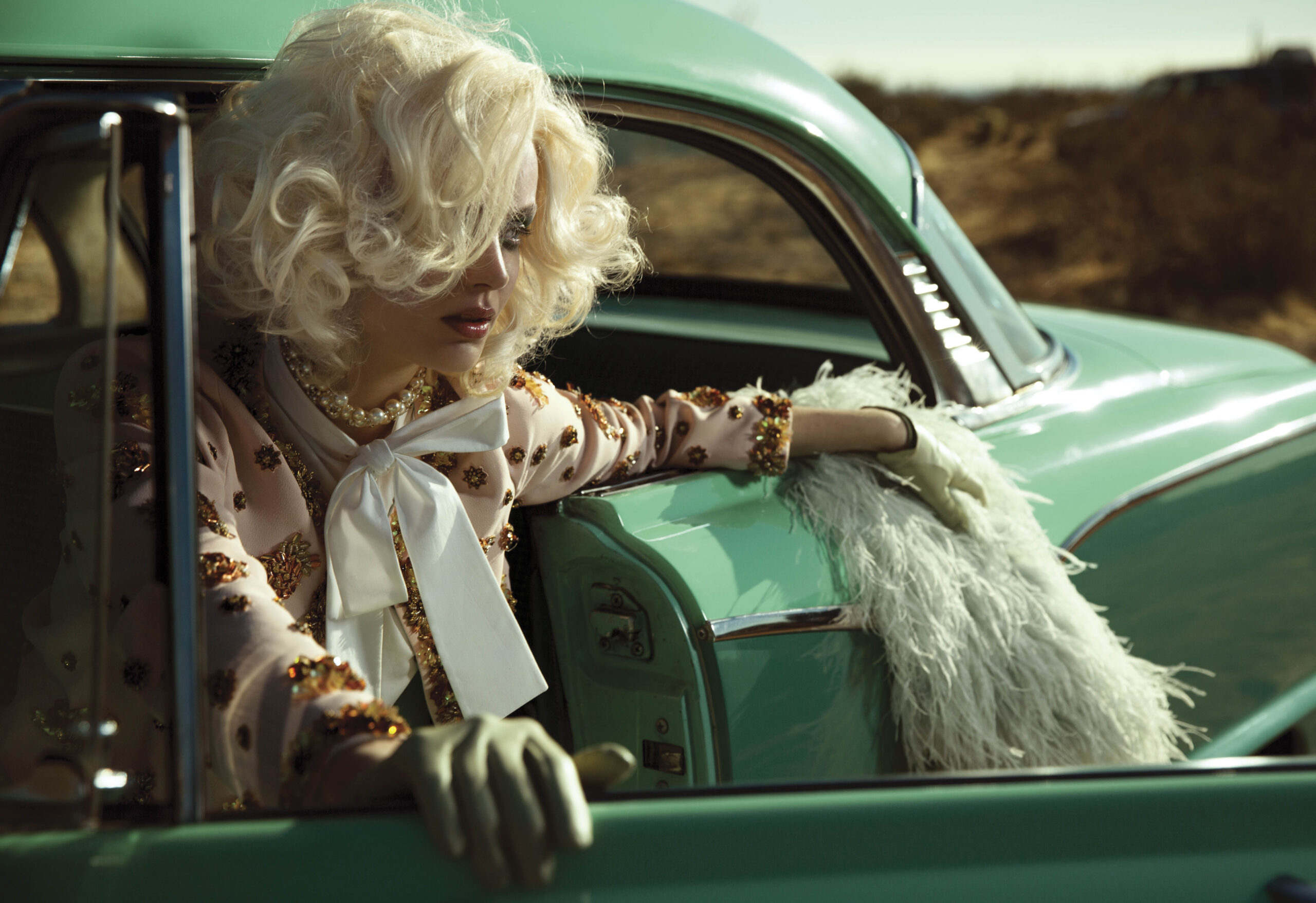 Limited edition print of a woman in a vintage car in the desert