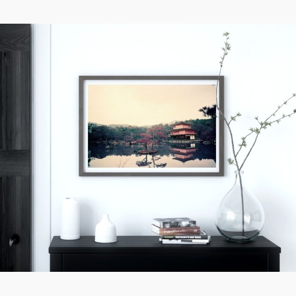 Print of a Japanese temple, hanging above a small table in an entrway