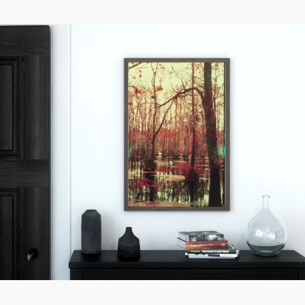 Print of a swamp landscape, hanging over a console table in an entryway