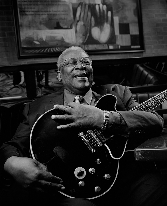 Legendary bluesman BB King, laughing and holding his guitar