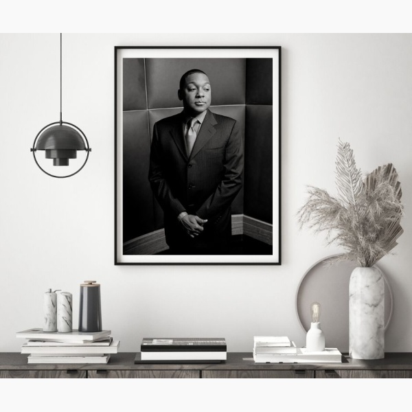 Framed portrait of Wynton Marsalis above a console table