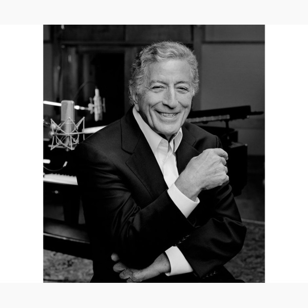 Tony Bennett in a recording studio, smiling at the camera