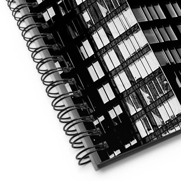 Close-up of a notebook with a photograph of a skyscraper façade