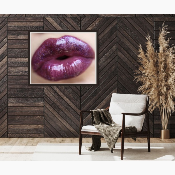 Framed print of a woman's lips, hanging in a reading nook