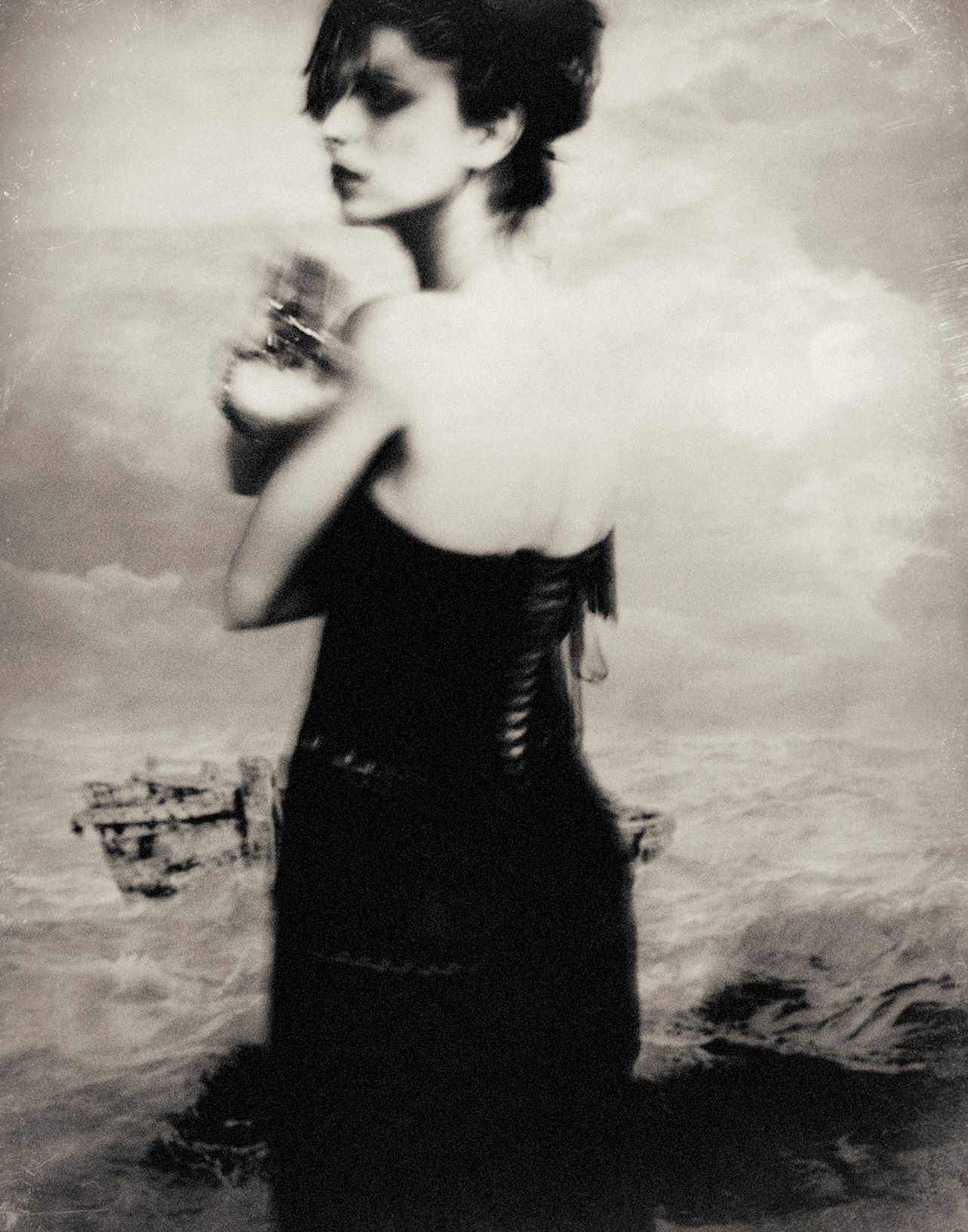 Superimposed portrait of a woman and of a seascape