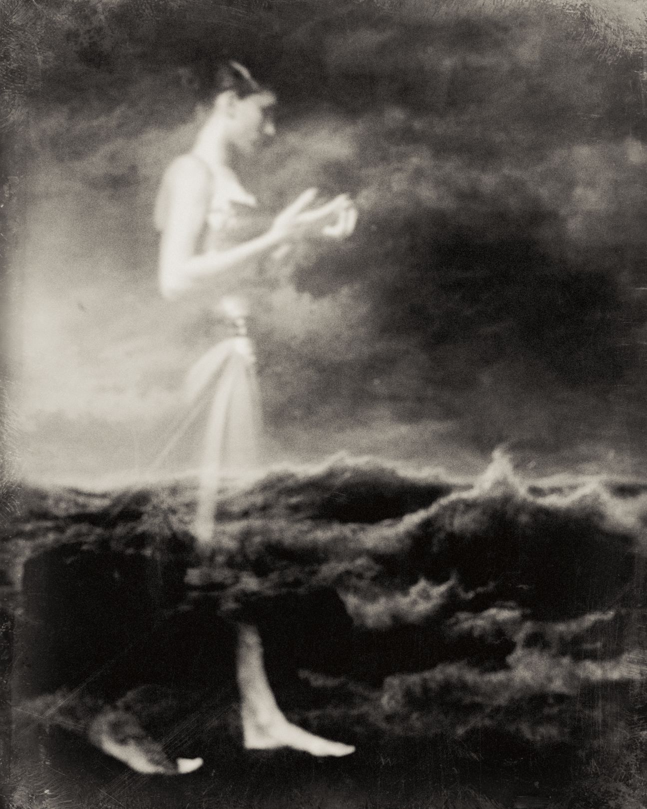 Superimposed photo of a woman walking and a stormy seascape
