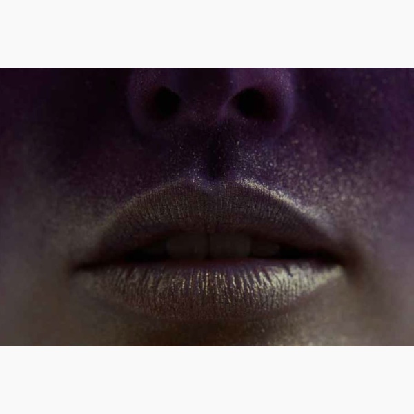 Close-up of a woman's mouth covered in glitter