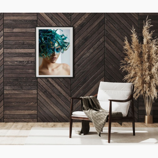 Framed print of a woman with green tentacles-like hair hanging in a reading nook corner