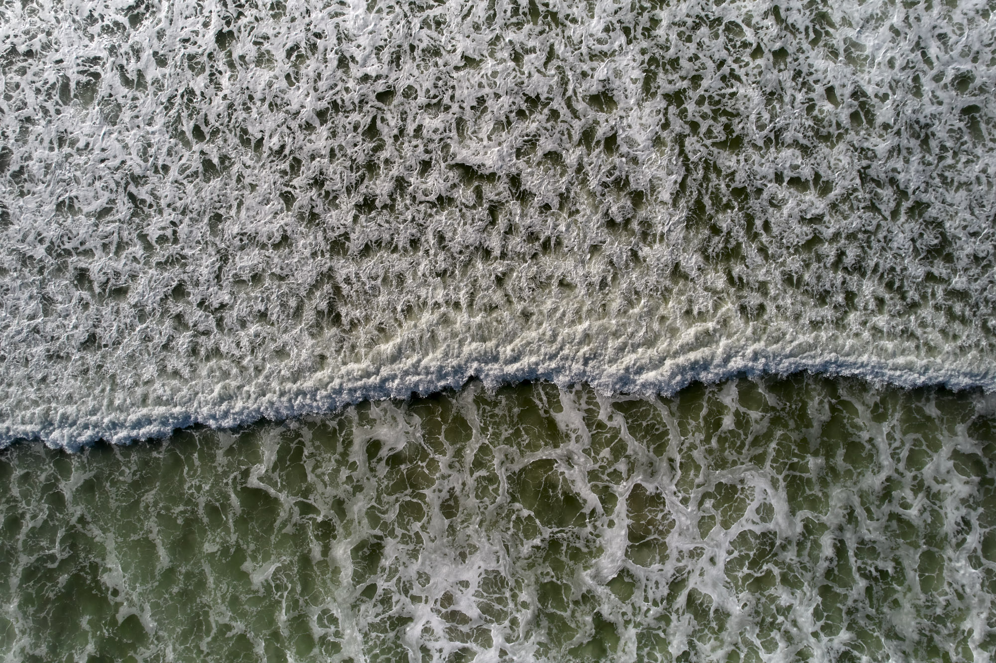 Limited edition print of an abstract aerial photography of surf and waves breaking