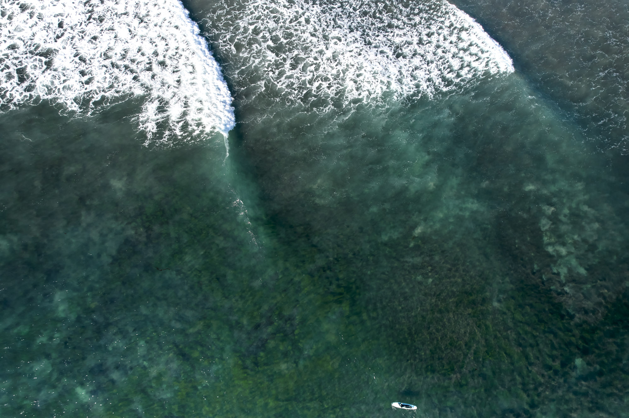 Limited edition print of an aerial photography of a surfer, seen from high above