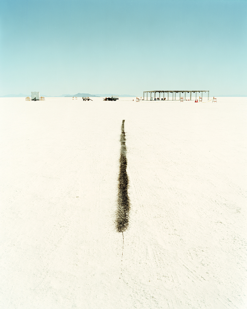 A short black line for car racing drawn on the ground of a salt flat